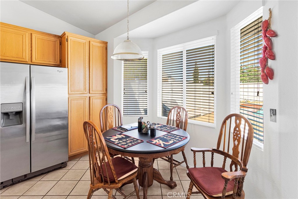 13863 Coachella Road Apple Valley, CA 92307 - Photo 18 of 53 a view of a dining room with furniture and a window