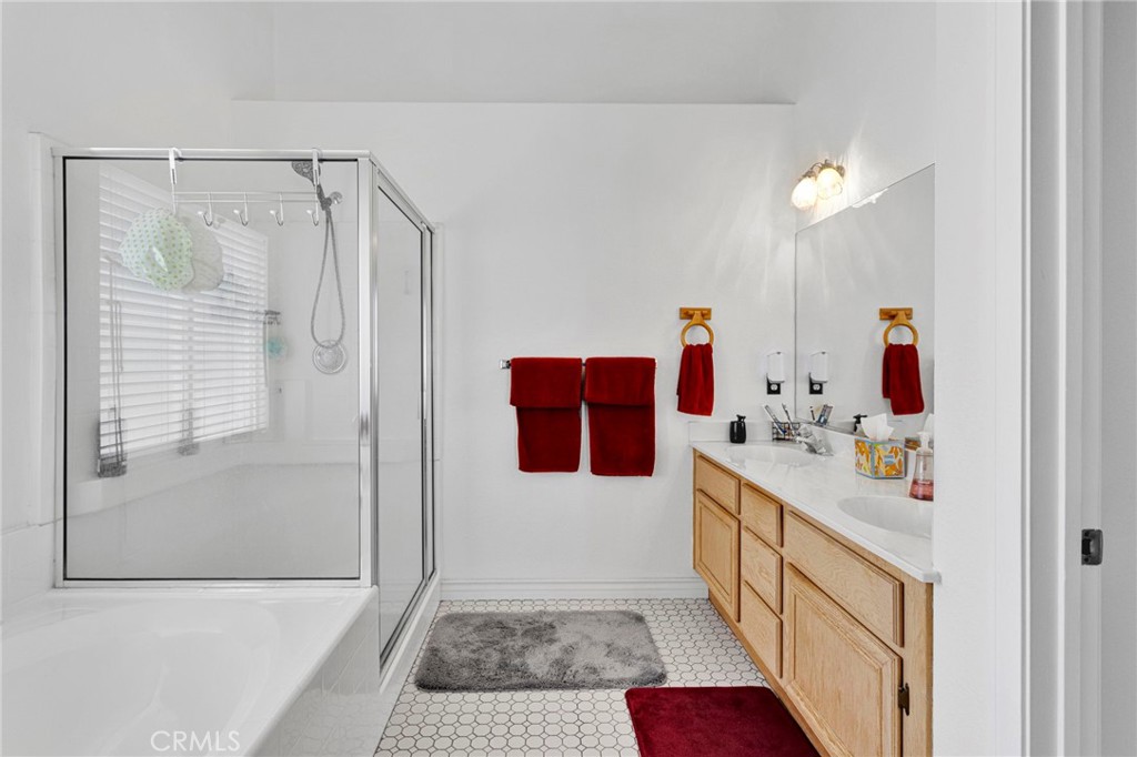 13863 Coachella Road Apple Valley, CA 92307 - Photo 27 of 53 a bathroom with a sink and mirror