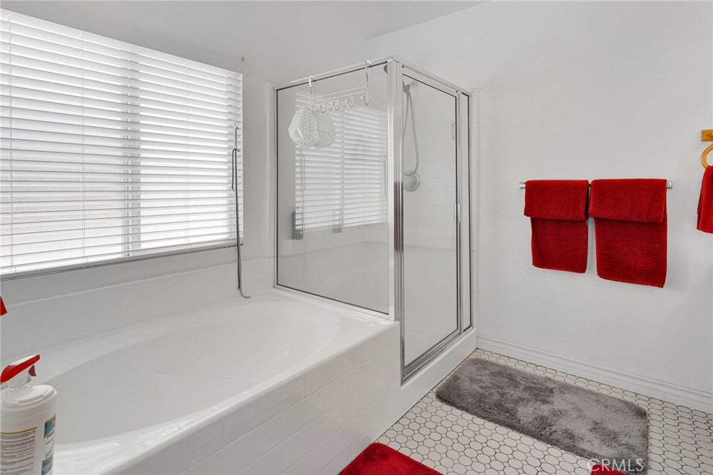 13863 Coachella Road Apple Valley, CA 92307 - Photo 28 of 53 a bathroom with a bathtub and a shower