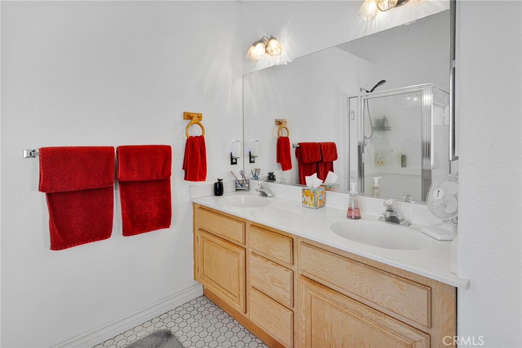 13863 Coachella Road Apple Valley, CA 92307 - Photo 29 of 53 a bathroom with a sink and a mirror