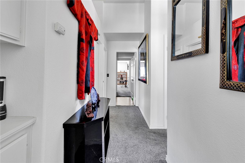 13863 Coachella Road Apple Valley, CA 92307 - Photo 30 of 53 a view of a hallway with workspace