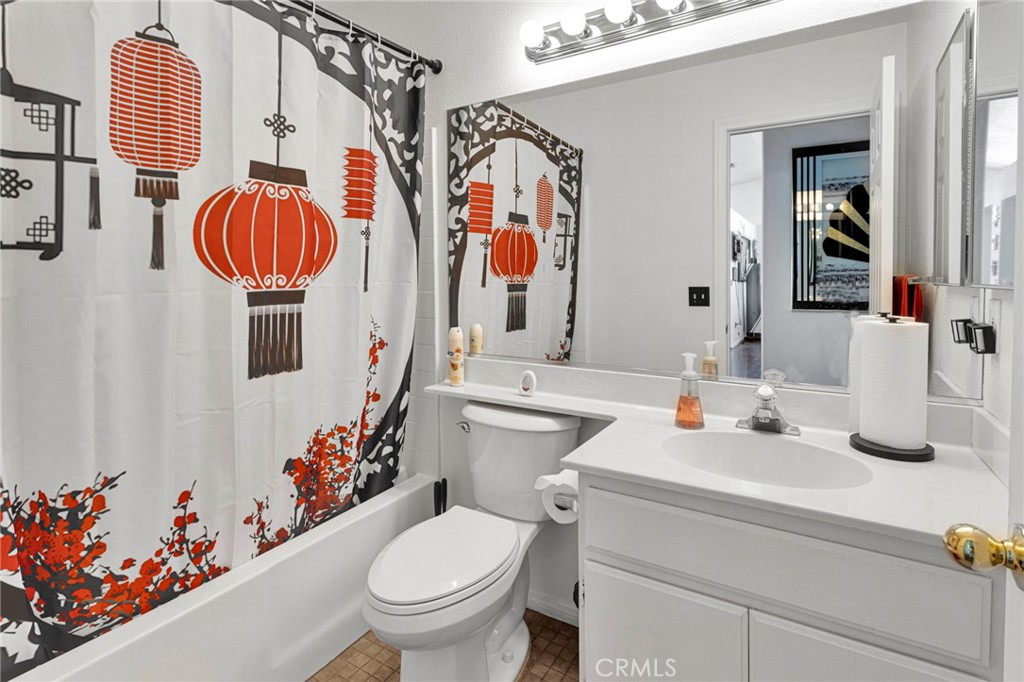 13863 Coachella Road Apple Valley, CA 92307 - Photo 31 of 53 a bathroom with a sink mirror and toilet