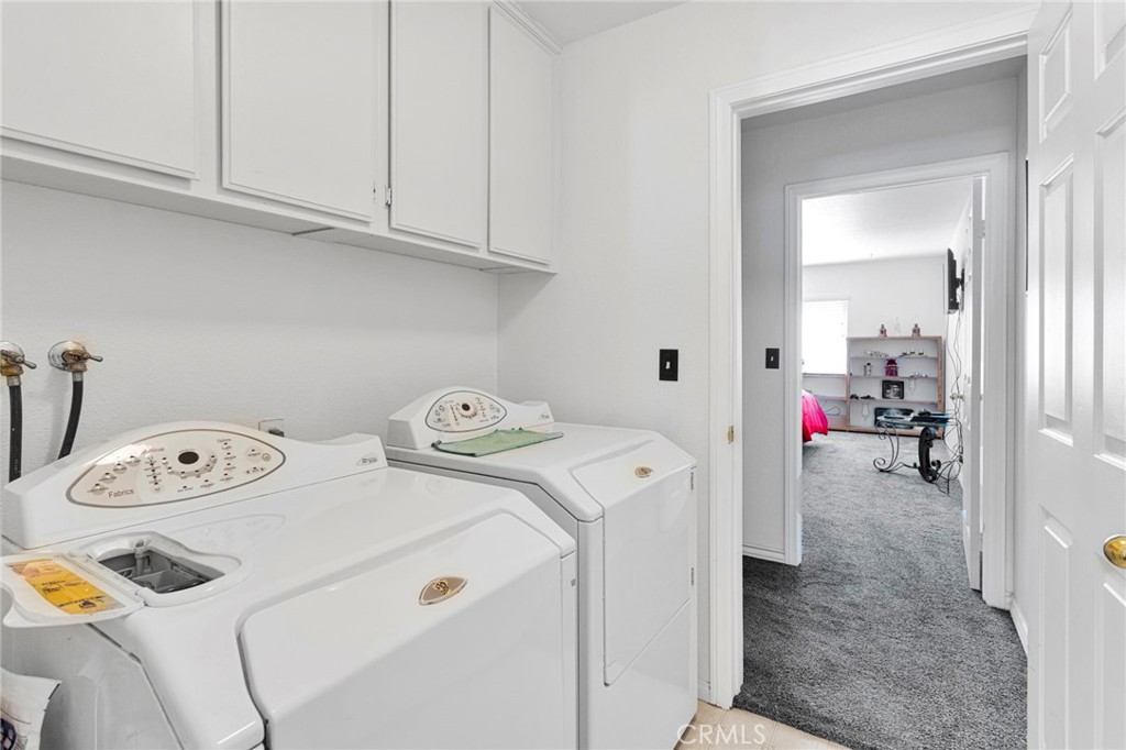 13863 Coachella Road Apple Valley, CA 92307 - Photo 34 of 53 a utility room with dryer and washer