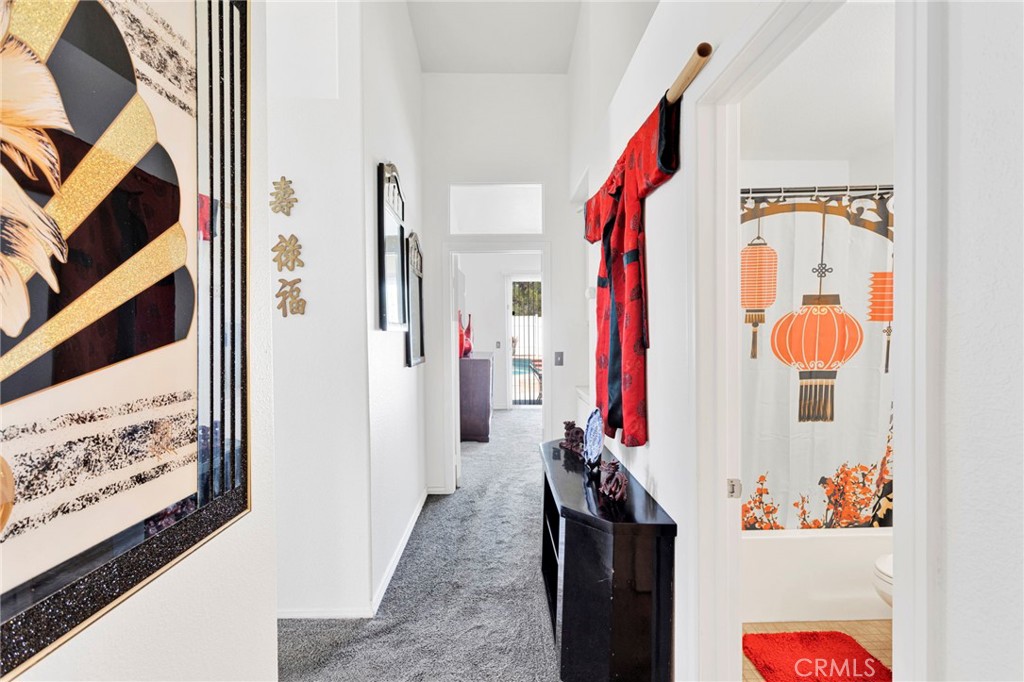 13863 Coachella Road Apple Valley, CA 92307 - Photo 38 of 53 a view of hallway with a flower pot and a fireplace