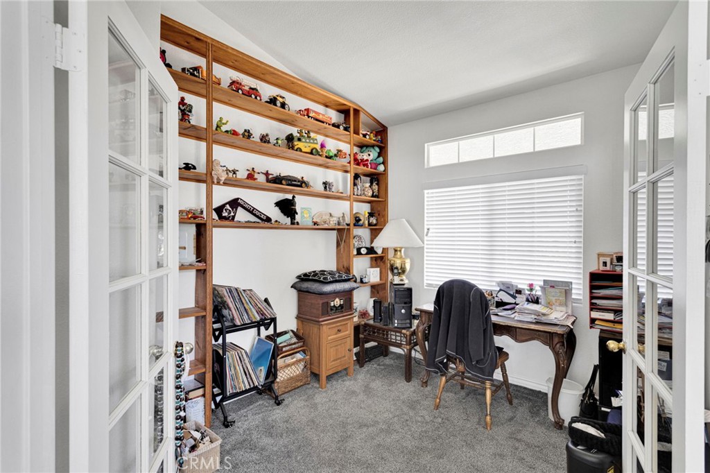 13863 Coachella Road Apple Valley, CA 92307 - Photo 39 of 53 a view of a workspace with furniture and a window