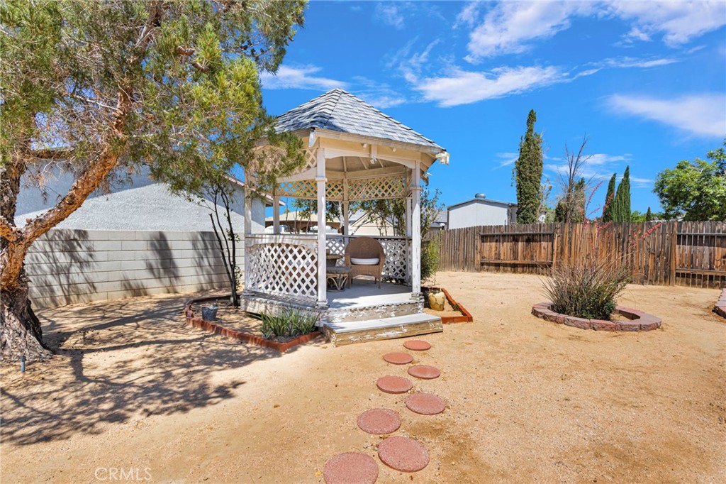 13863 Coachella Road Apple Valley, CA 92307 - Photo 44 of 53 a view of a house with wooden fence