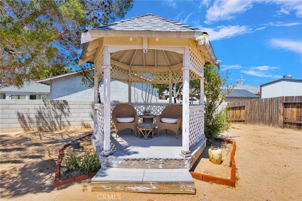 13863 Coachella Road Apple Valley, CA 92307 - Photo 45 of 53 a view of a building with sitting area