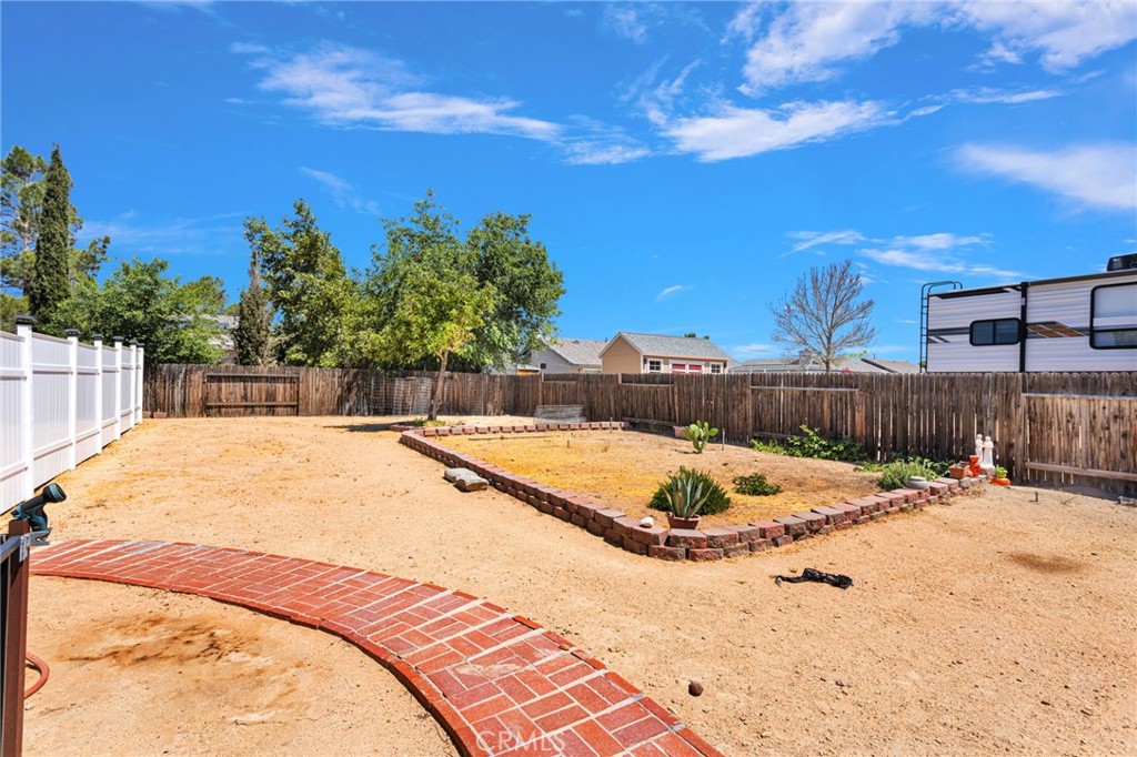 13863 Coachella Road Apple Valley, CA 92307 - Photo 50 of 53 a view of a swimming pool with a yard