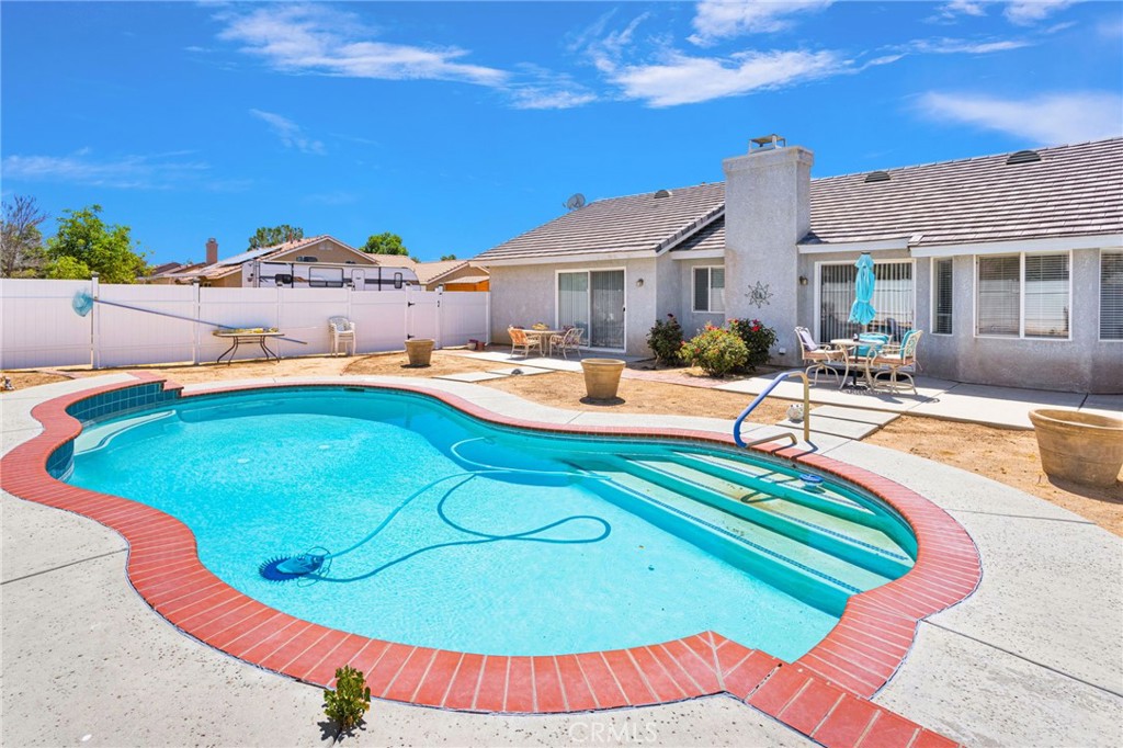13863 Coachella Road Apple Valley, CA 92307 - Photo 6 of 53 a swimming pool with outdoor seating
