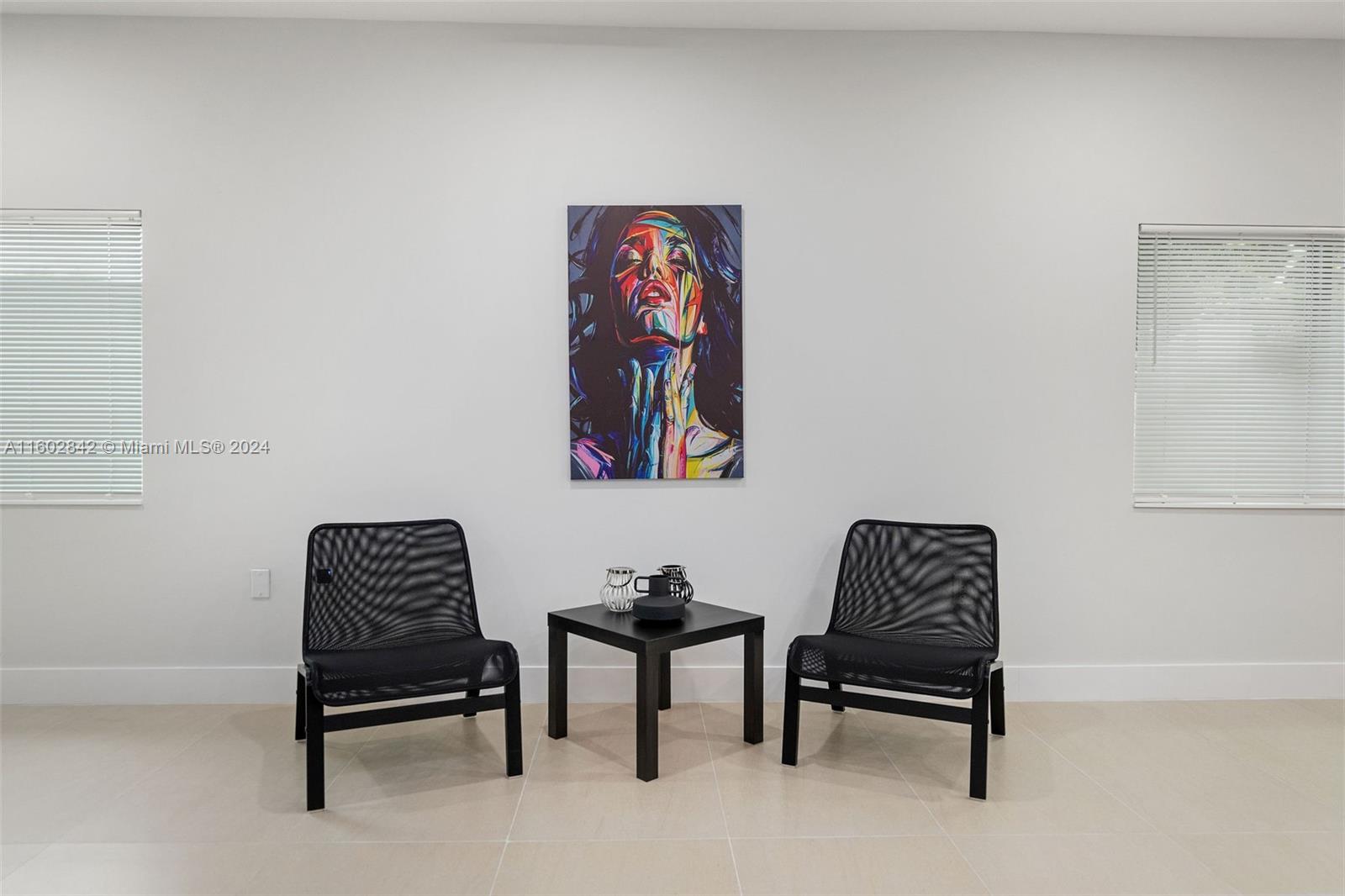 Allapattah Miami, FL 33142 - Photo 13 of 27 a living room with furniture and a chair