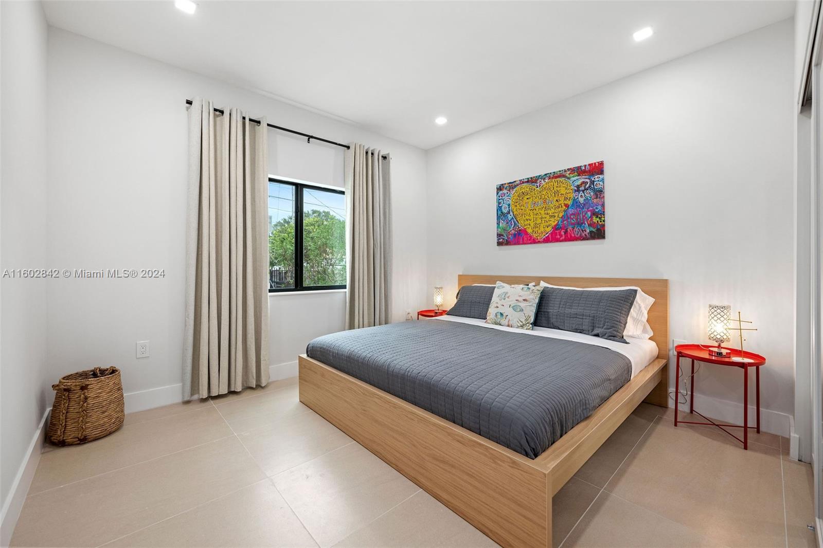 Allapattah Miami, FL 33142 - Photo 18 of 27 a bed room with a bed and a chair