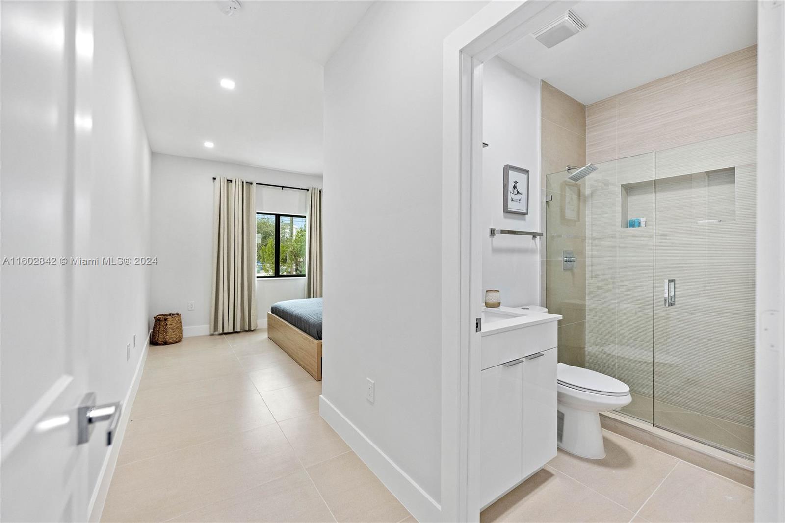 Allapattah Miami, FL 33142 - Photo 19 of 27 a bathroom with a sink a toilet and shower