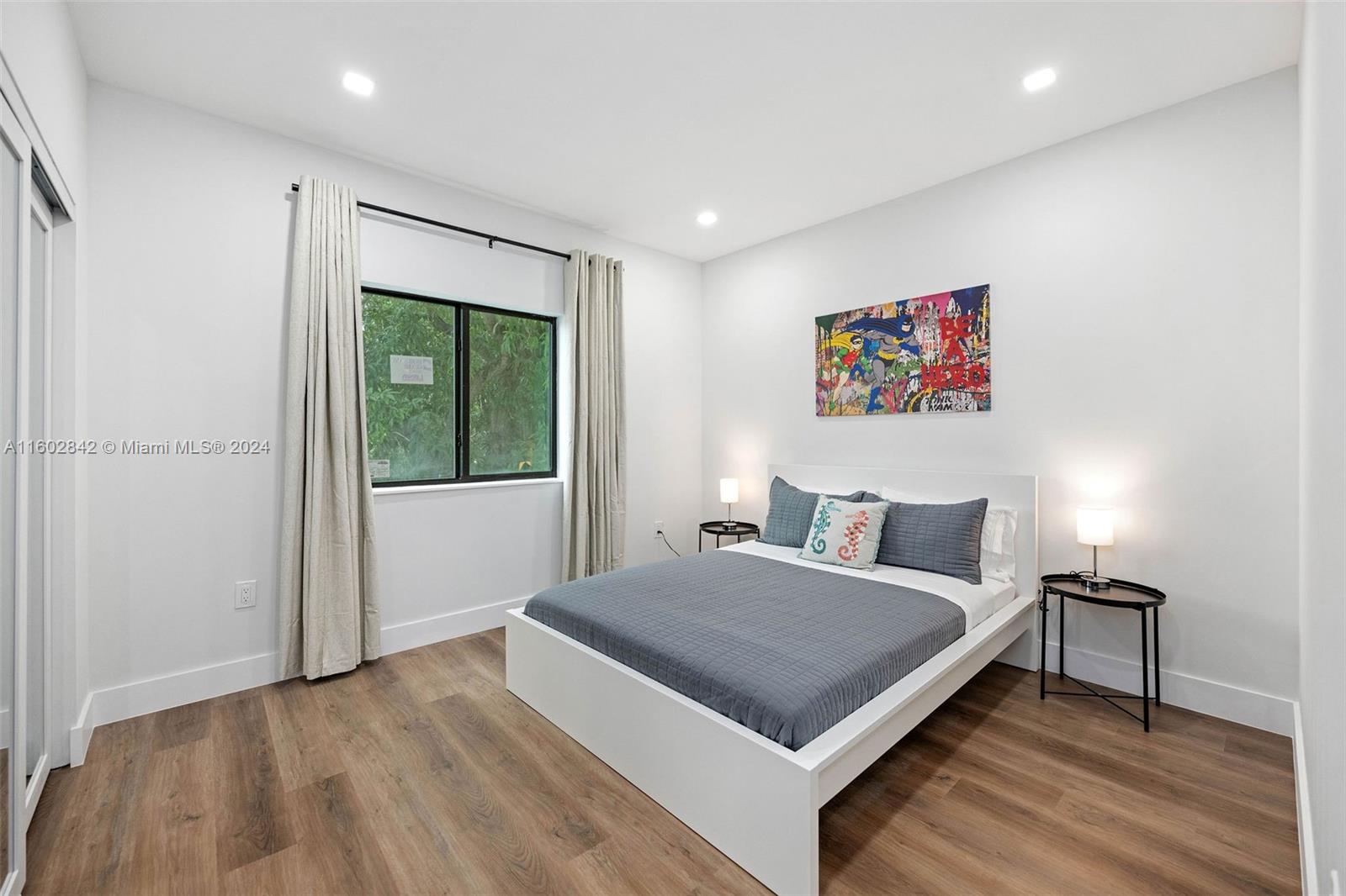 Allapattah Miami, FL 33142 - Photo 20 of 27 a bedroom with a bed and a table