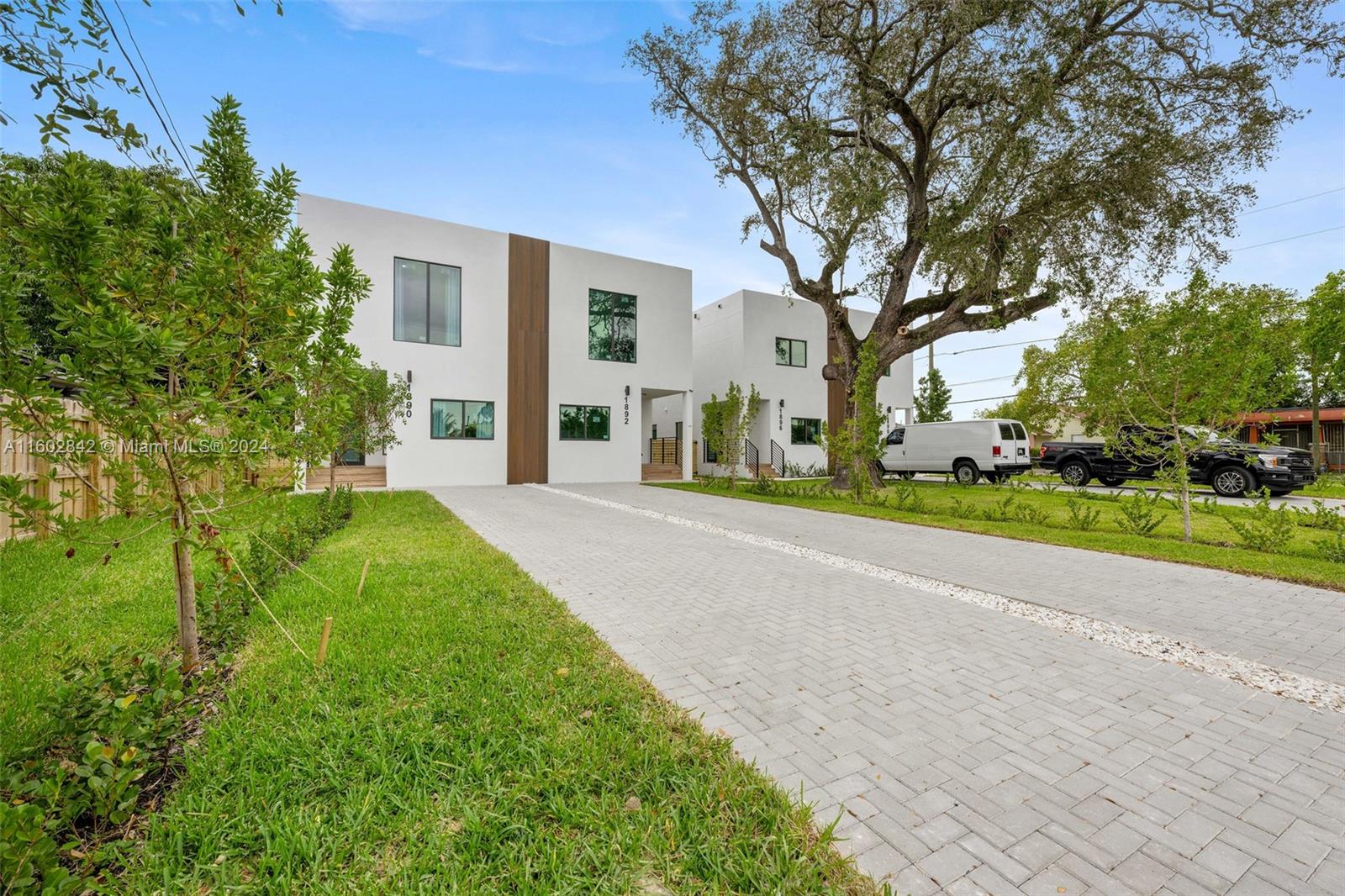 Allapattah Miami, FL 33142 - Photo 2 of 27 a view of a house with a yard and large tree