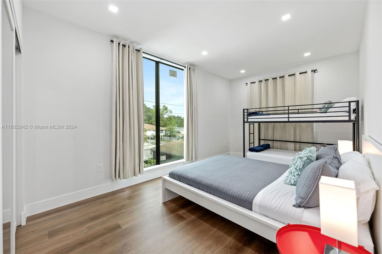 Allapattah Miami, FL 33142 - Photo 22 of 27 a bedroom with furniture and a window