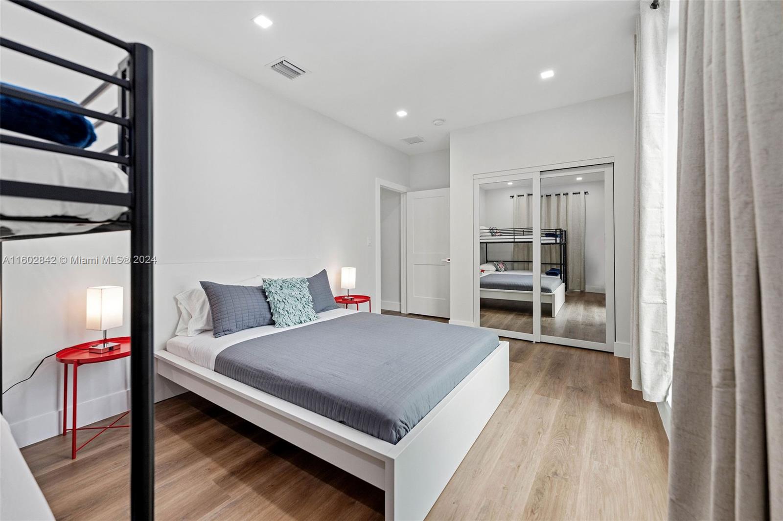 Allapattah Miami, FL 33142 - Photo 23 of 27 a living room with a bed furniture and a window