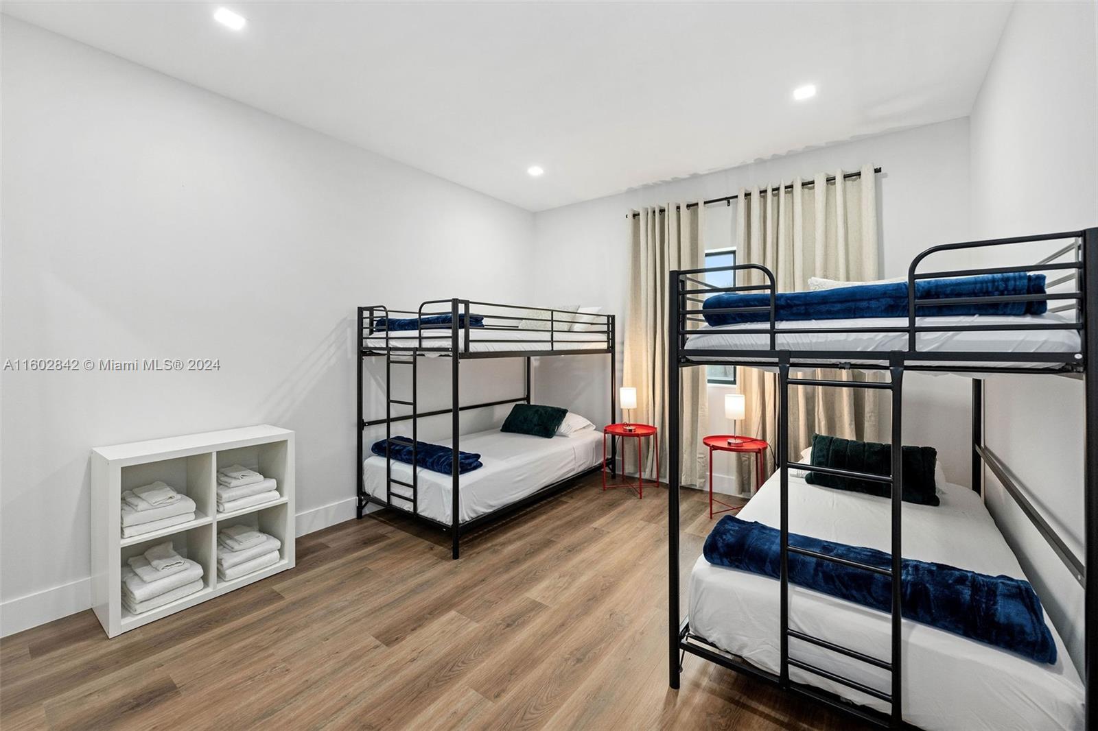 Allapattah Miami, FL 33142 - Photo 24 of 27 a bedroom with furniture and wooden floor