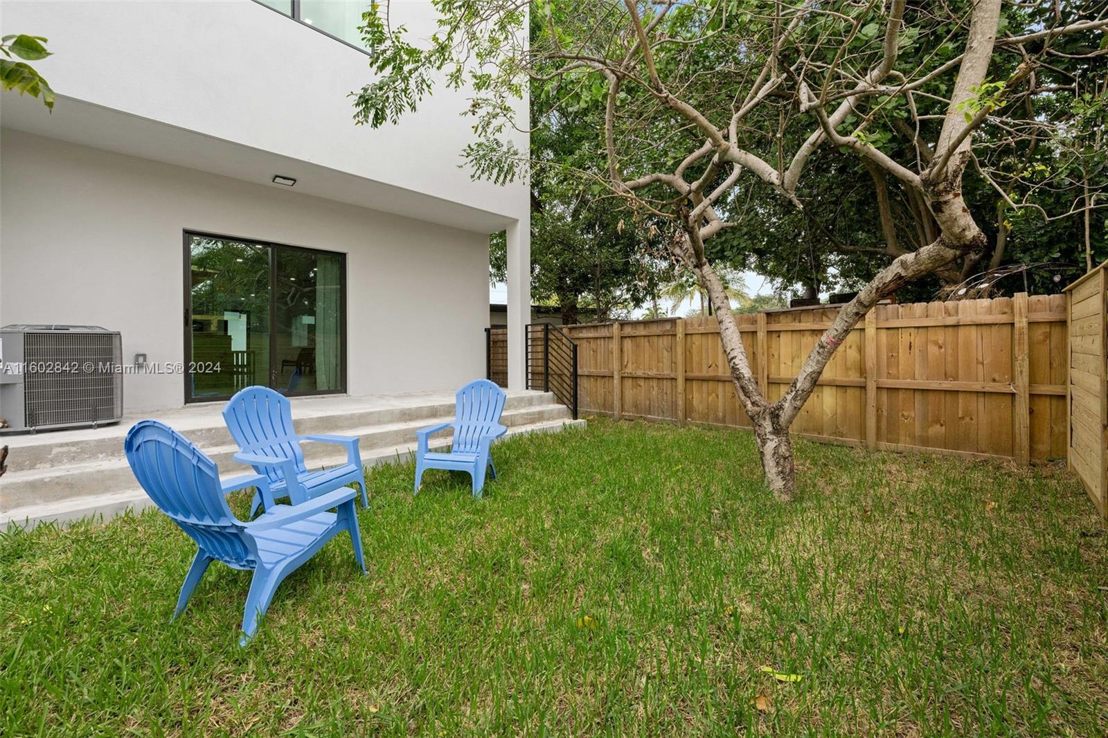 Allapattah Miami, FL 33142 - Photo 27 of 27 a view of a chair and table in backyard of the house