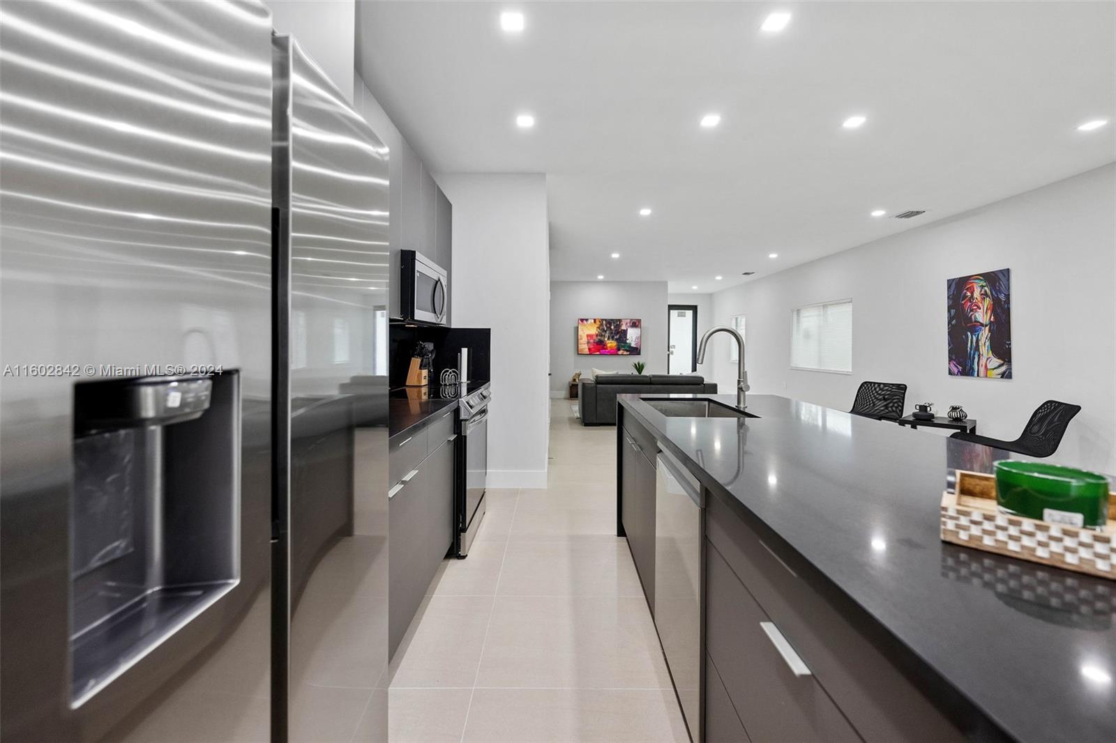 Allapattah Miami, FL 33142 - Photo 8 of 27 a large kitchen with stainless steel appliances lots of counter top space