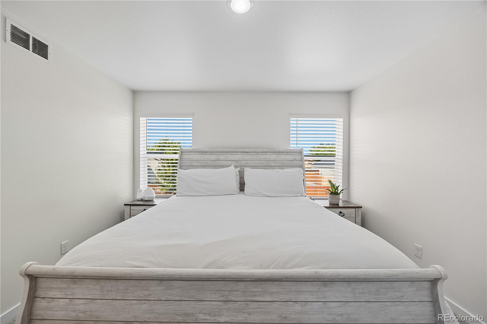 669 South Hoover Avenue Fort Lupton, CO 80621 - Photo 16 of 24 a large white bed in a room