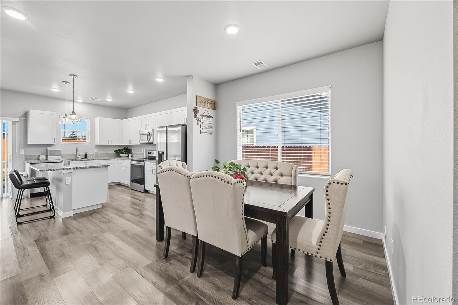 669 South Hoover Avenue Fort Lupton, CO 80621 - Photo 4 of 24 a view of a dining room with furniture and window