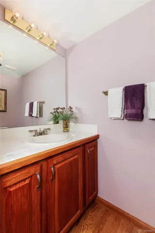 a kitchen with stainless steel appliances granite countertop dining table chairs and a view of living room
