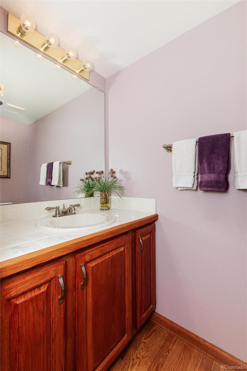 9635 Cherryvale Drive Highlands Ranch, CO 80126 - Photo 18 of 46 a bathroom with a sink and a mirror