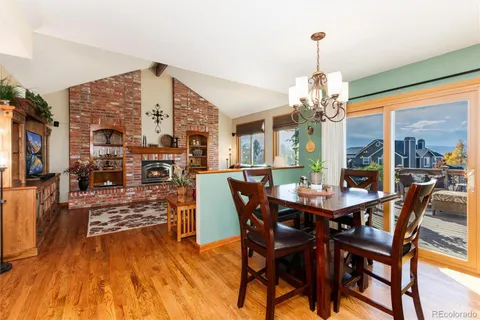 a view of a dining room with furniture wooden floor and chandelier