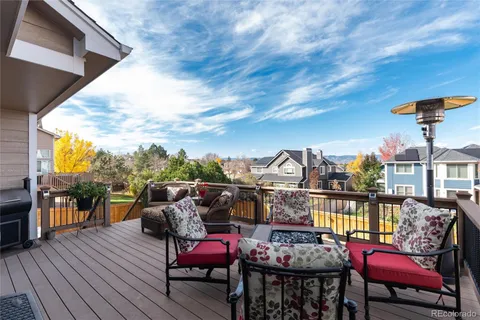 a view of a chairs and table in the balcony