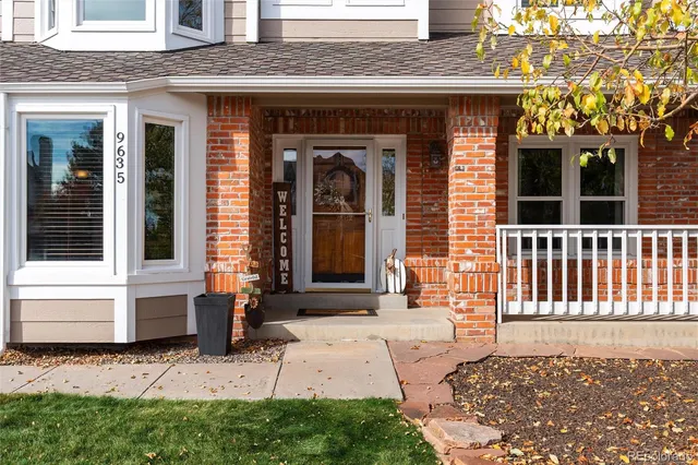 a front view of a house with a chair