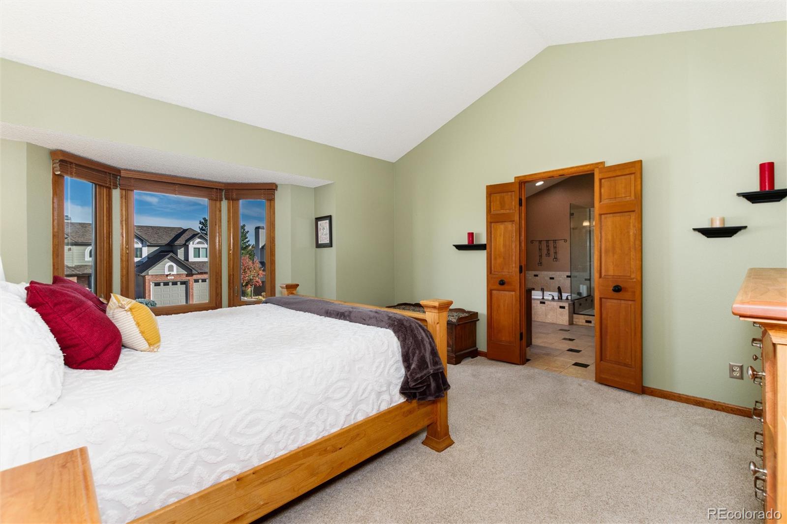 9635 Cherryvale Drive Highlands Ranch, CO 80126 - Photo 23 of 46 a bed sitting in a bedroom next to a window