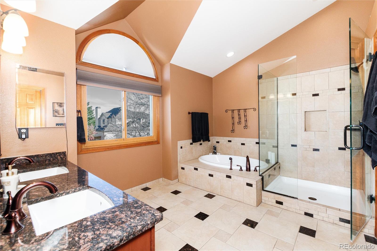 9635 Cherryvale Drive Highlands Ranch, CO 80126 - Photo 26 of 46 a bedroom with a bed and a large mirror on the dresser