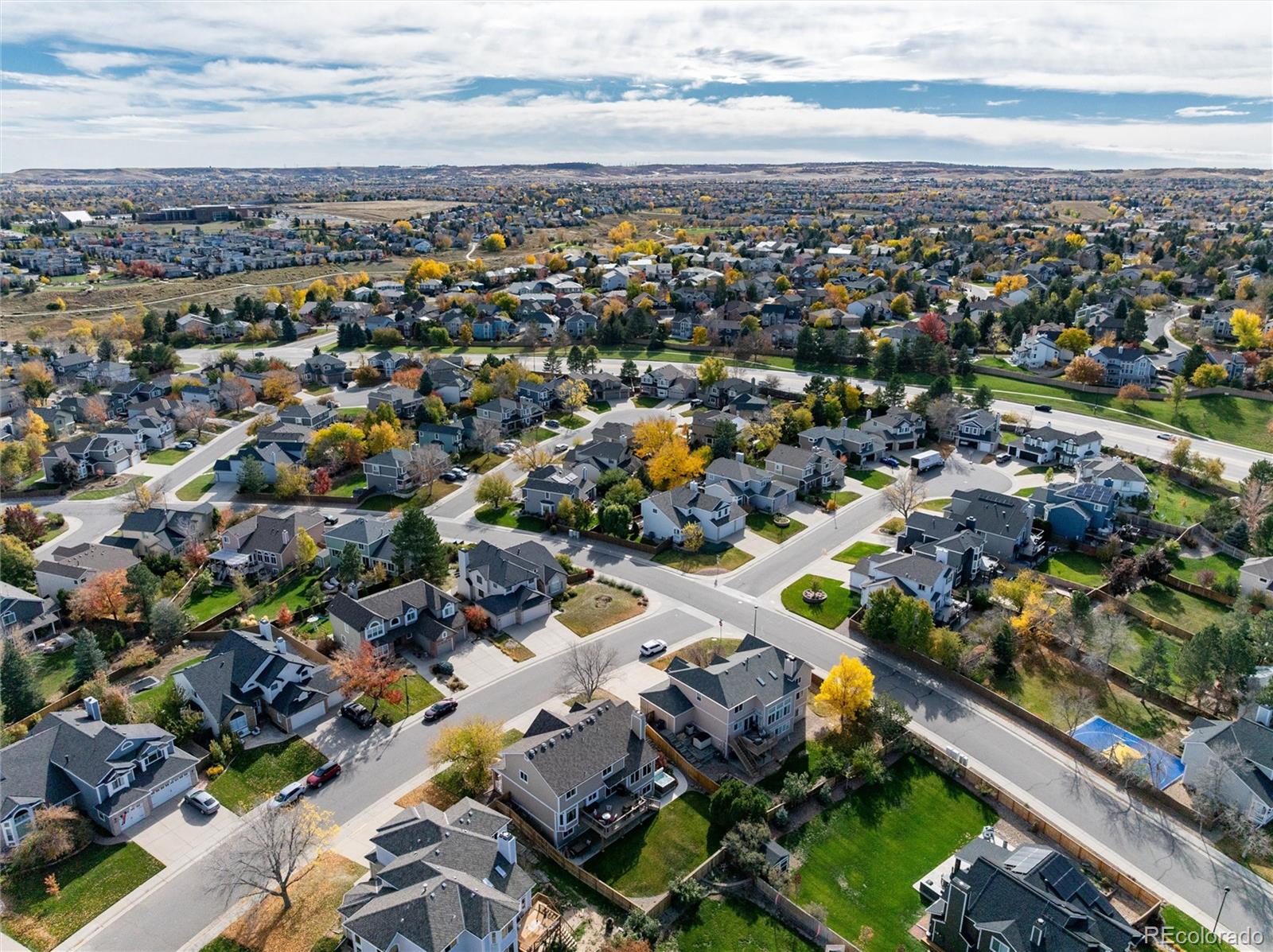 9635 Cherryvale Drive Highlands Ranch, CO 80126 - Photo 3 of 46 an aerial view of a city with lots of residential buildings
