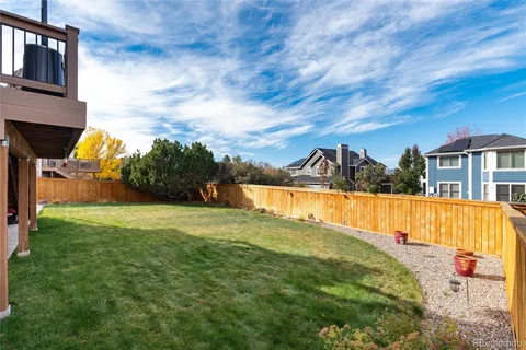 a view of swimming pool is middle in the garden