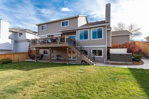 a view of a house with a yard porch and sitting area