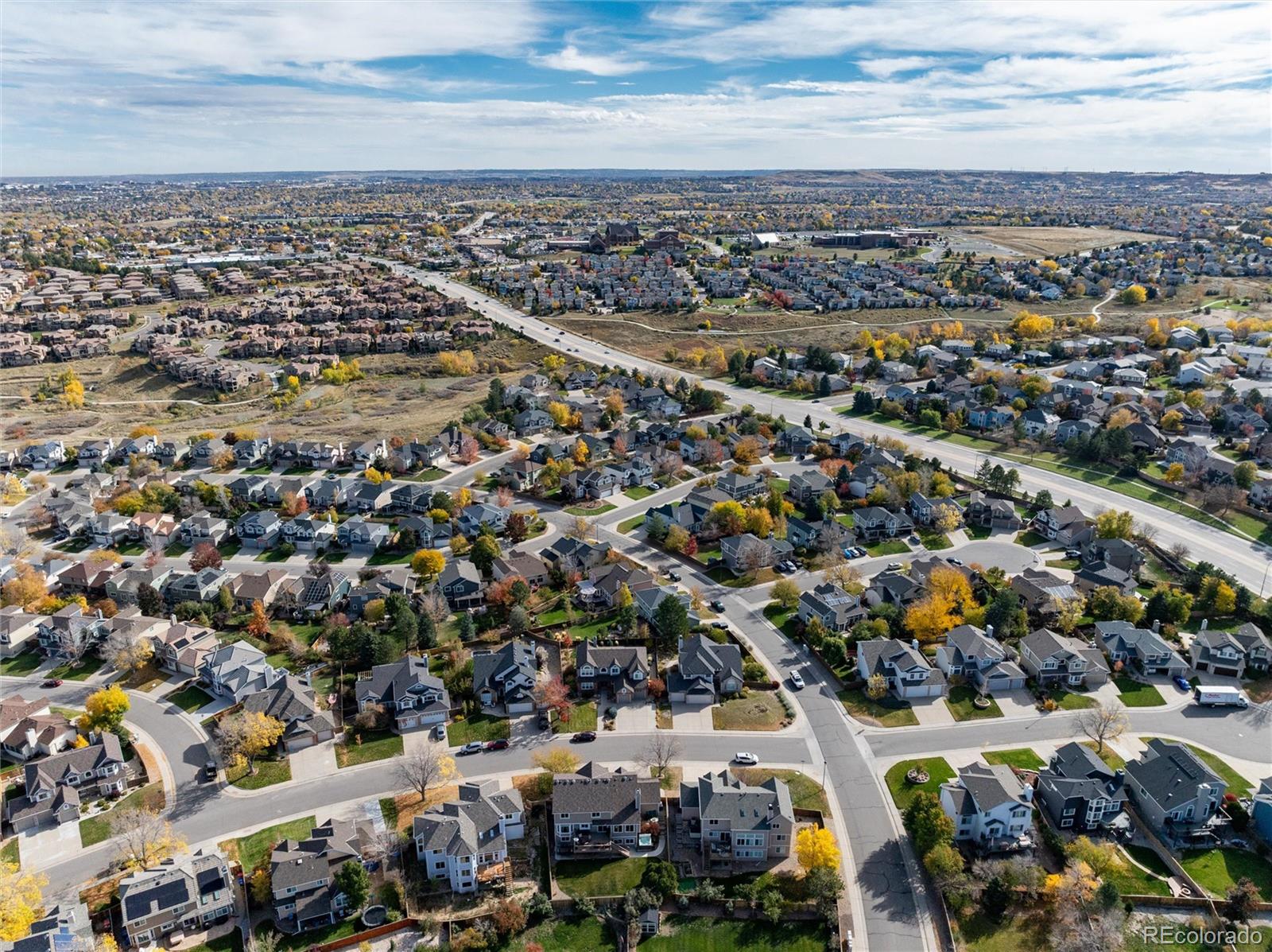 9635 Cherryvale Drive Highlands Ranch, CO 80126 - Photo 42 of 46 an aerial view of a city with lots of residential buildings