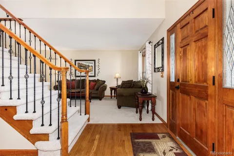 a view of living room filled with furniture and a rug