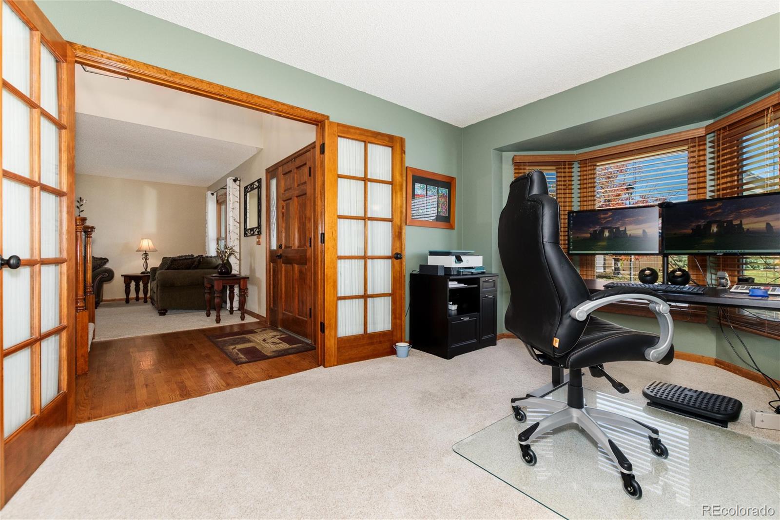 9635 Cherryvale Drive Highlands Ranch, CO 80126 - Photo 7 of 46 a view of a livingroom with workspace and a window