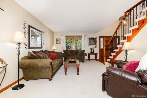 a living room with furniture or stairs and a couch