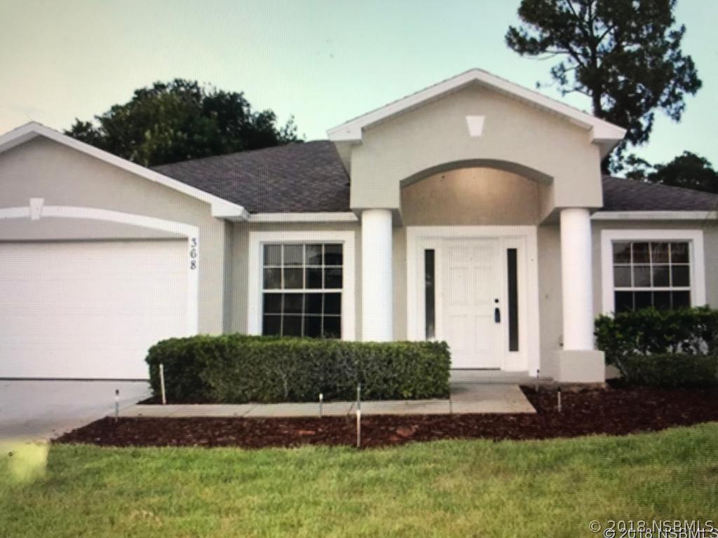 368 Mariners Gate Drive Edgewater, FL 32141 - Photo 1 of 1 a front view of a house with a yard
