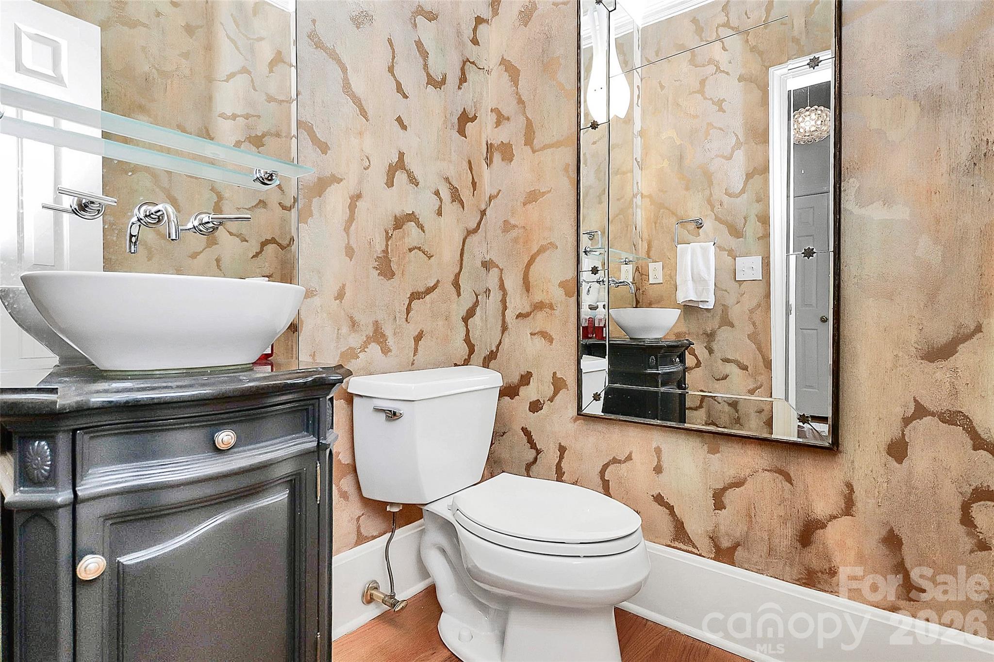 304 South Canterbury Road Charlotte, NC 28211 - Photo 12 of 39 a bathroom with a granite countertop toilet a sink and a shower