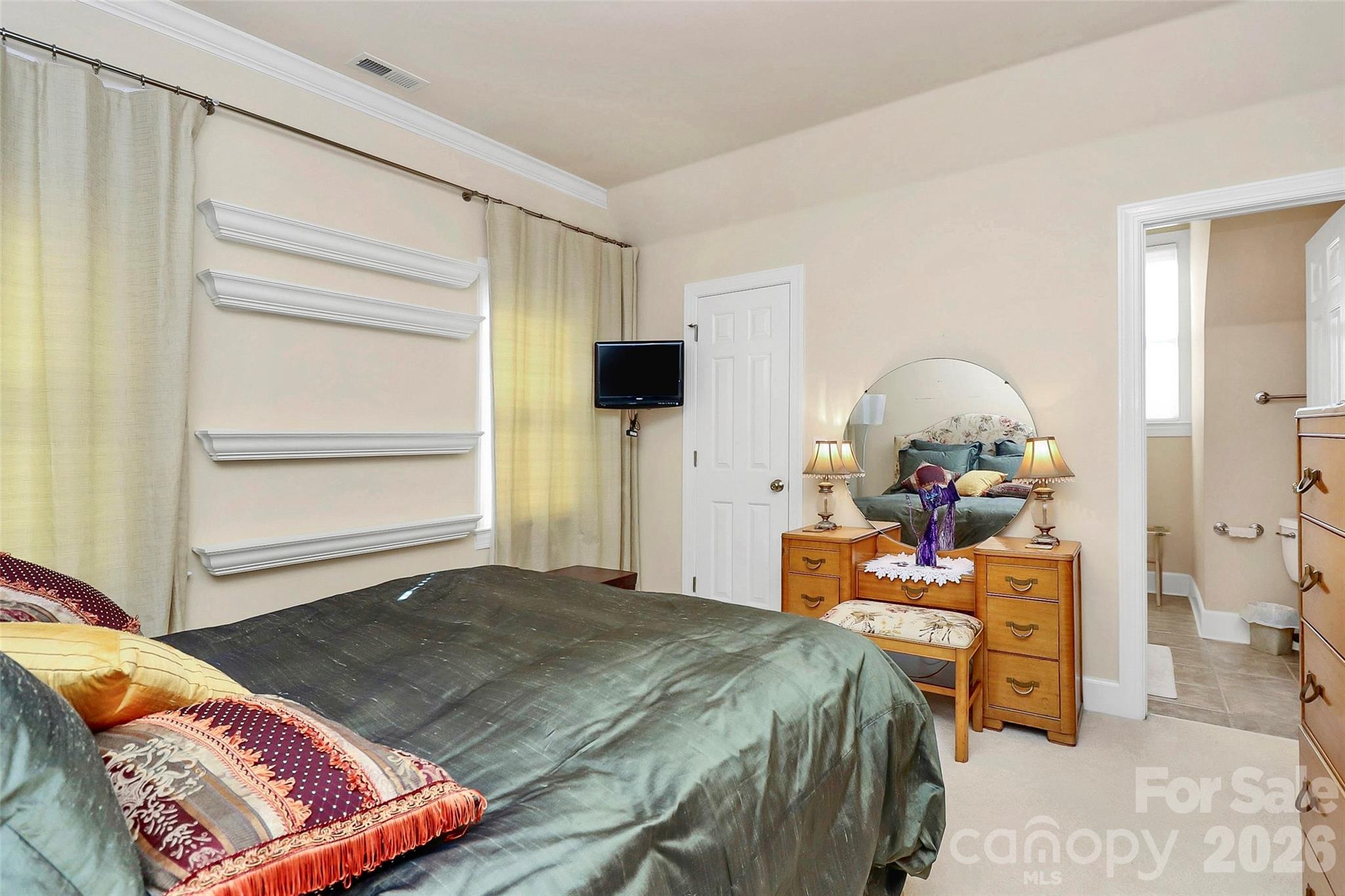 304 South Canterbury Road Charlotte, NC 28211 - Photo 24 of 39 a bedroom with a bed and wooden floor