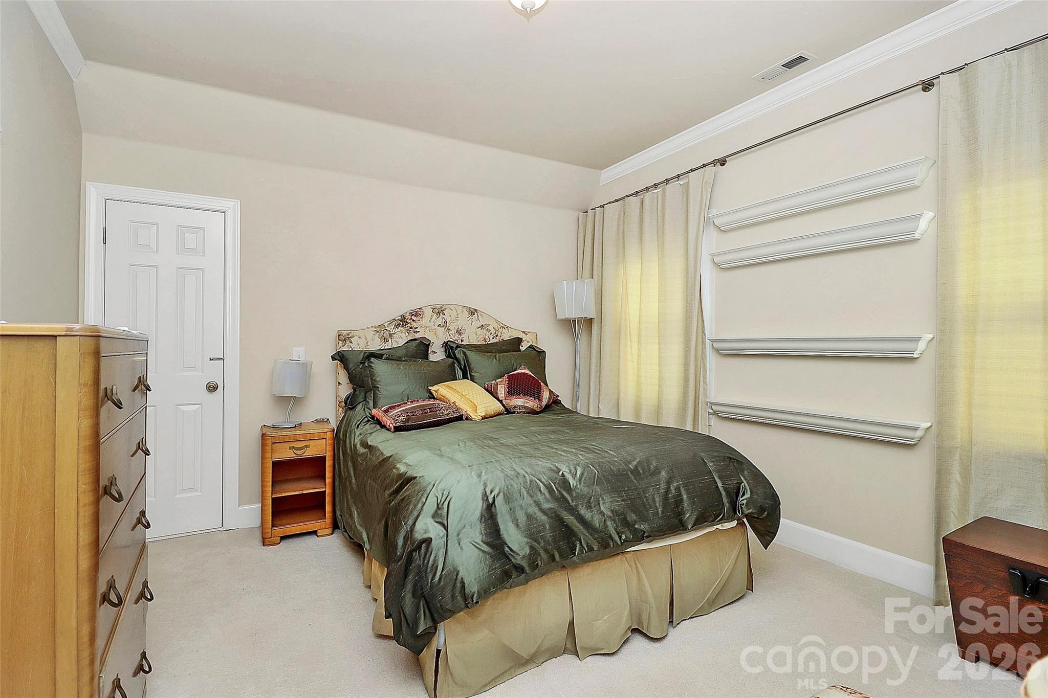 304 South Canterbury Road Charlotte, NC 28211 - Photo 24 of 39 a bedroom with a bed and a cabinets