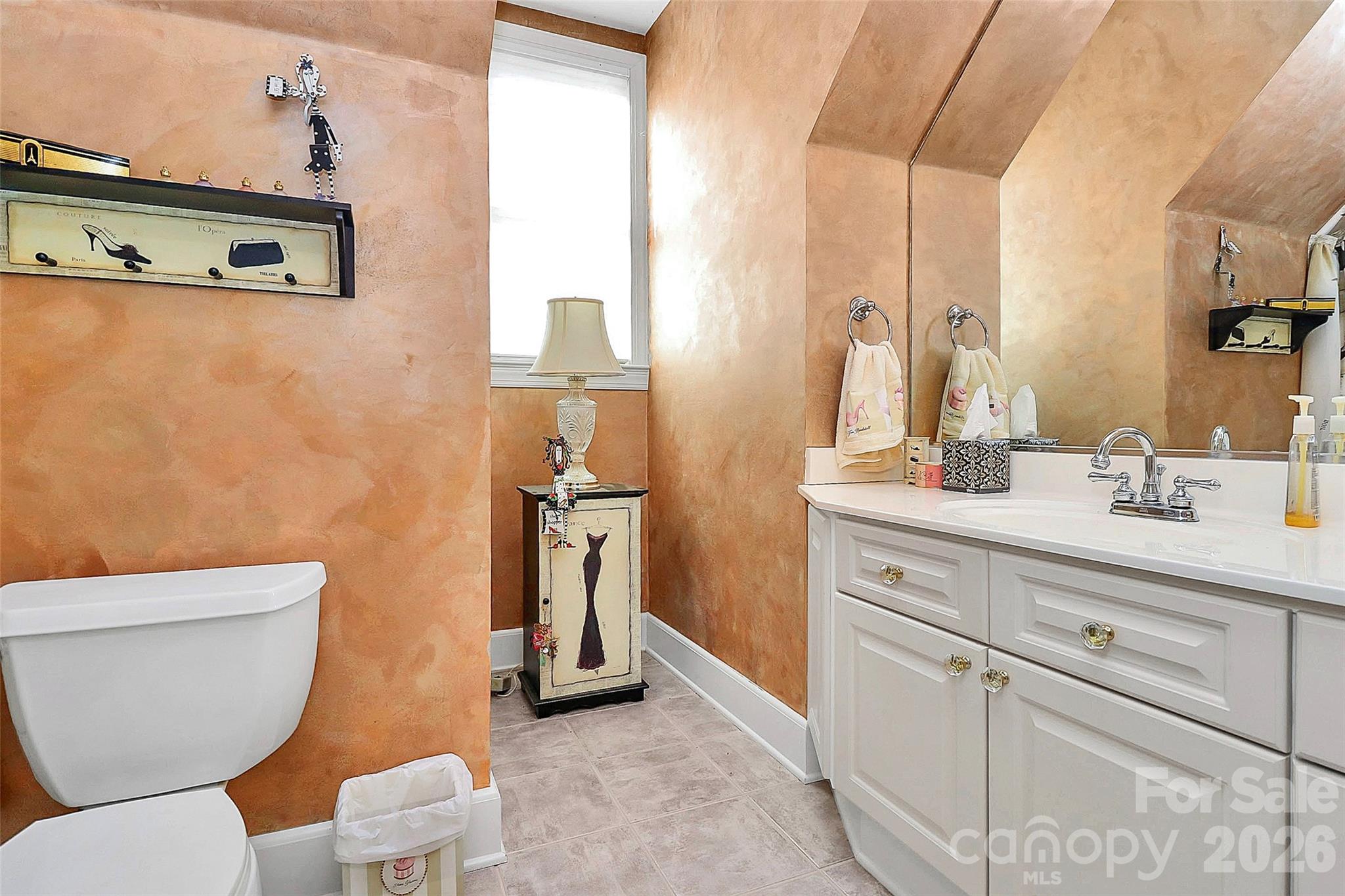 304 South Canterbury Road Charlotte, NC 28211 - Photo 29 of 39 a bathroom with a toilet sink and mirror