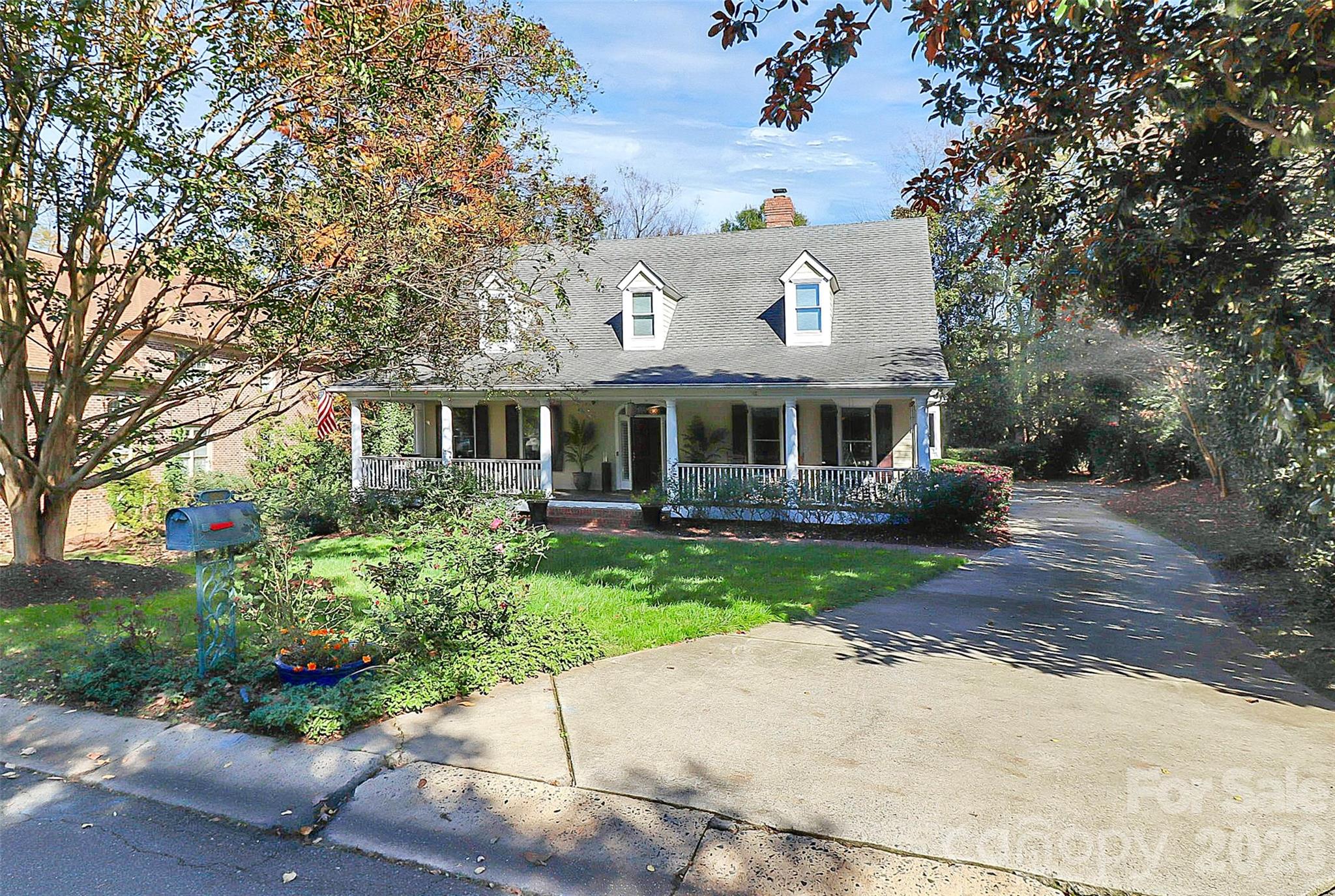 304 South Canterbury Road Charlotte, NC 28211 - Photo 31 of 39 a front view of a house with a garden and porch