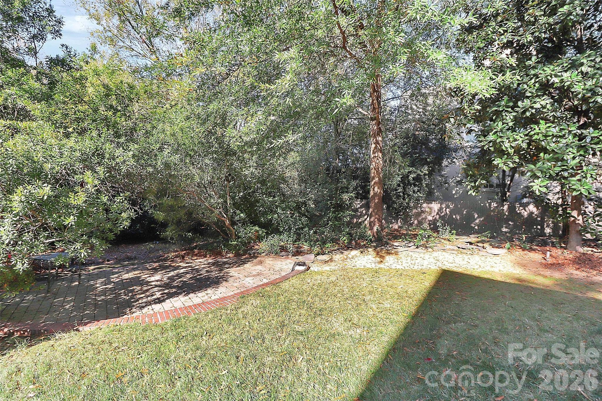 304 South Canterbury Road Charlotte, NC 28211 - Photo 37 of 39 a view of a yard with large trees