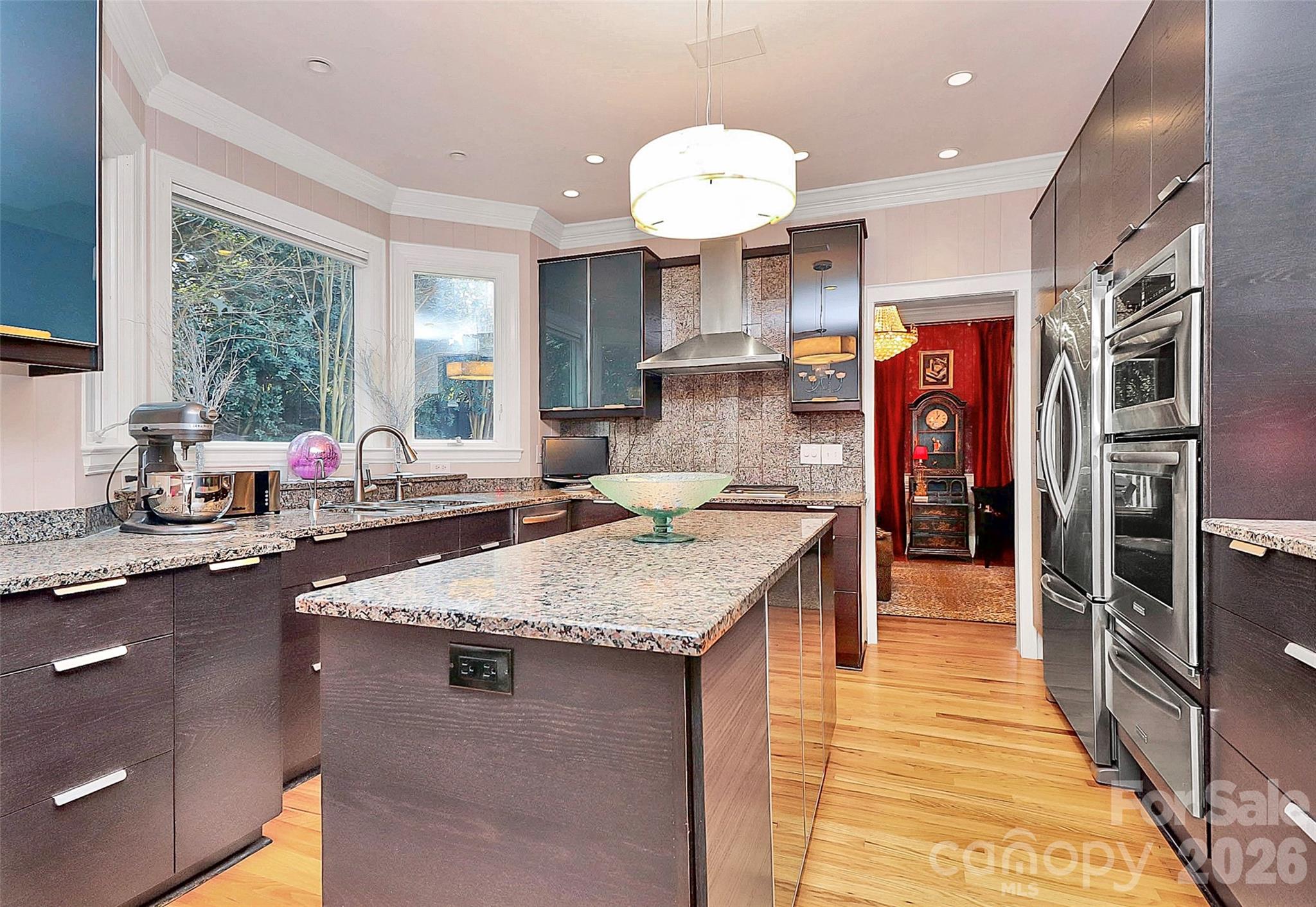 304 South Canterbury Road Charlotte, NC 28211 - Photo 5 of 39 a kitchen with stainless steel appliances granite countertop a sink refrigerator and cabinets