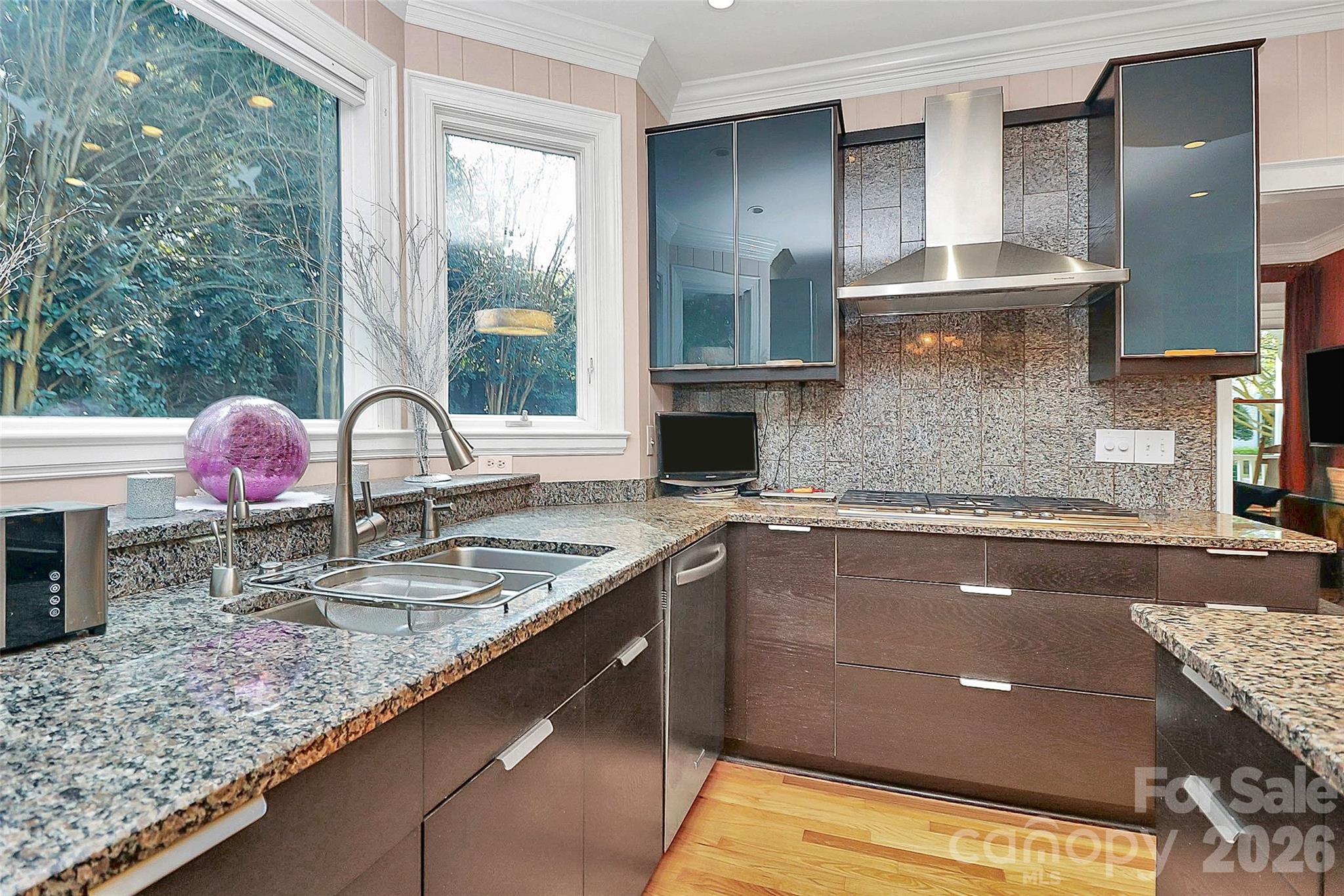 304 South Canterbury Road Charlotte, NC 28211 - Photo 9 of 39 a kitchen with kitchen island granite countertop a sink a stove and cabinets