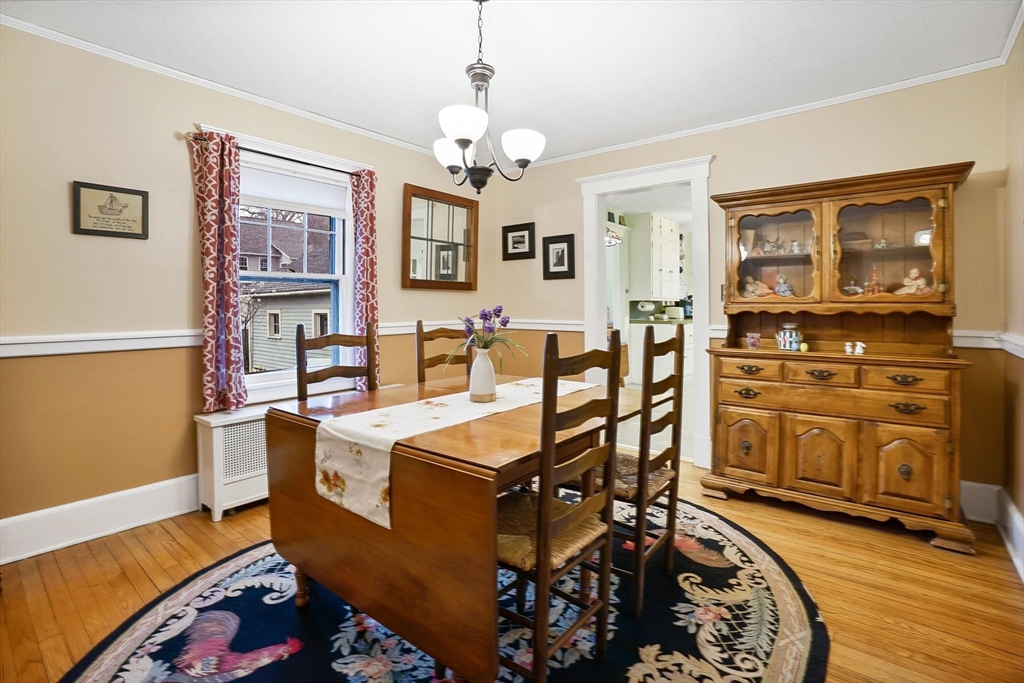 30 Wexford Street Springfield, MA 01118 - Photo 6 of 27 a living room with furniture a chandelier and a dining table