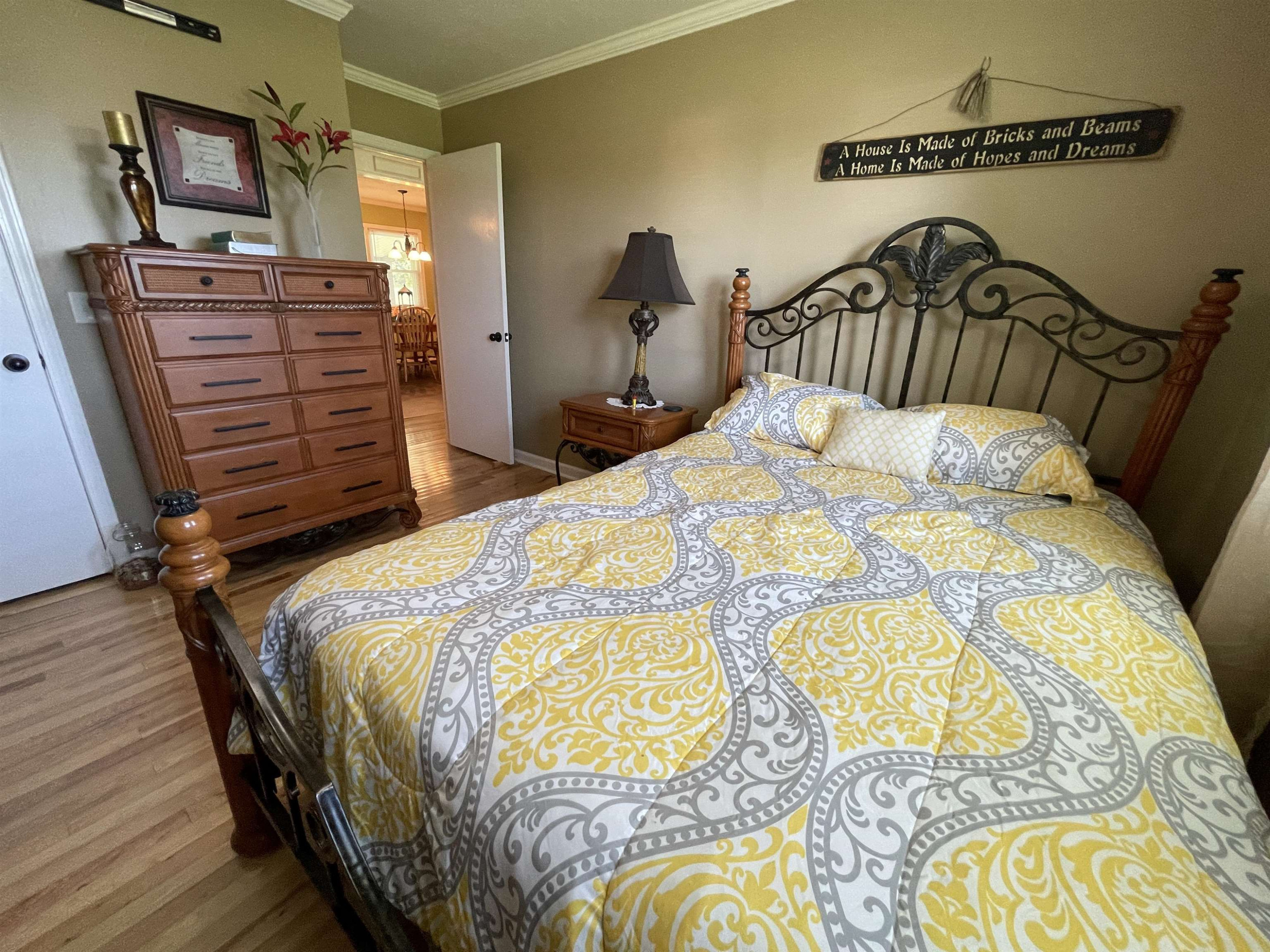 2507 East Grove Road Gleason, TN 38229 - Photo 14 of 37 a bedroom with a bed and wooden floor